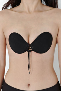 Self-adhesive bra with lacing